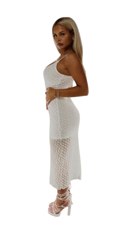 Cameron Comfort standing in a white dress
